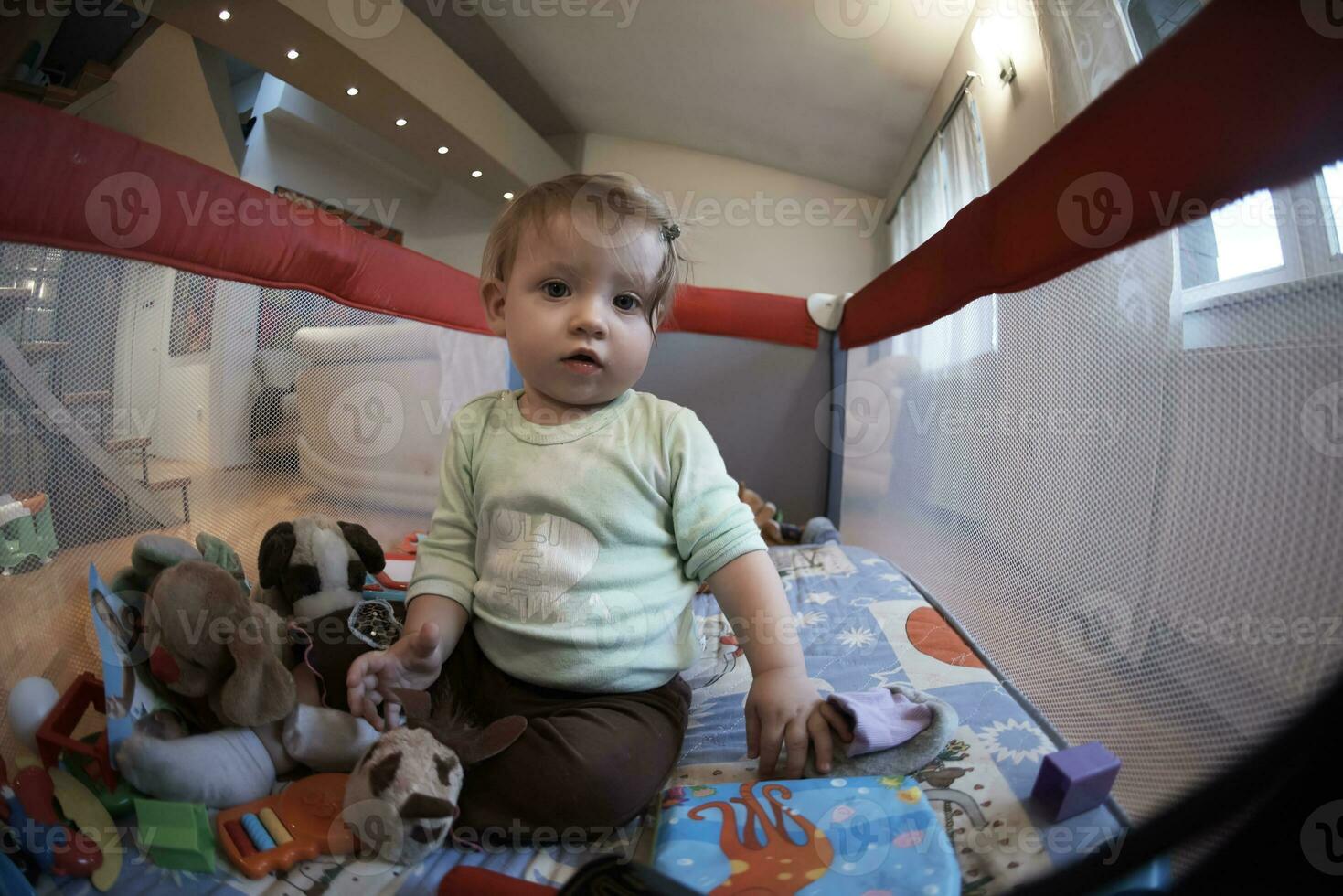 cute  little  baby playing in mobile  bed photo