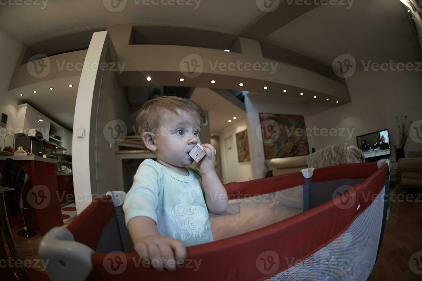 cute  little  baby playing in mobile  bed photo