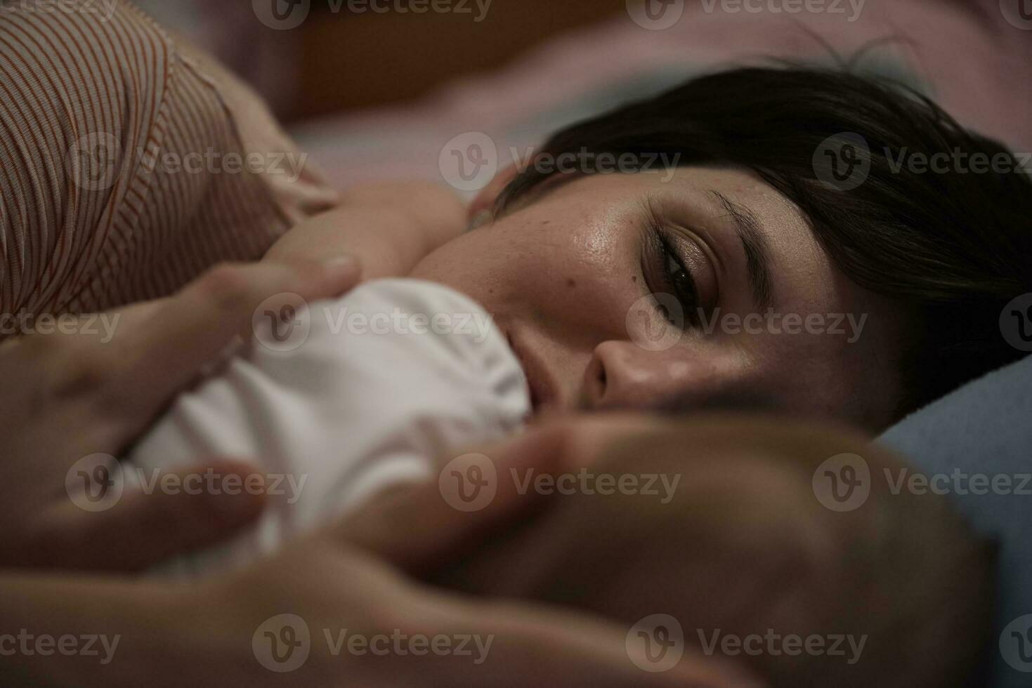 mother is playing with baby at home photo