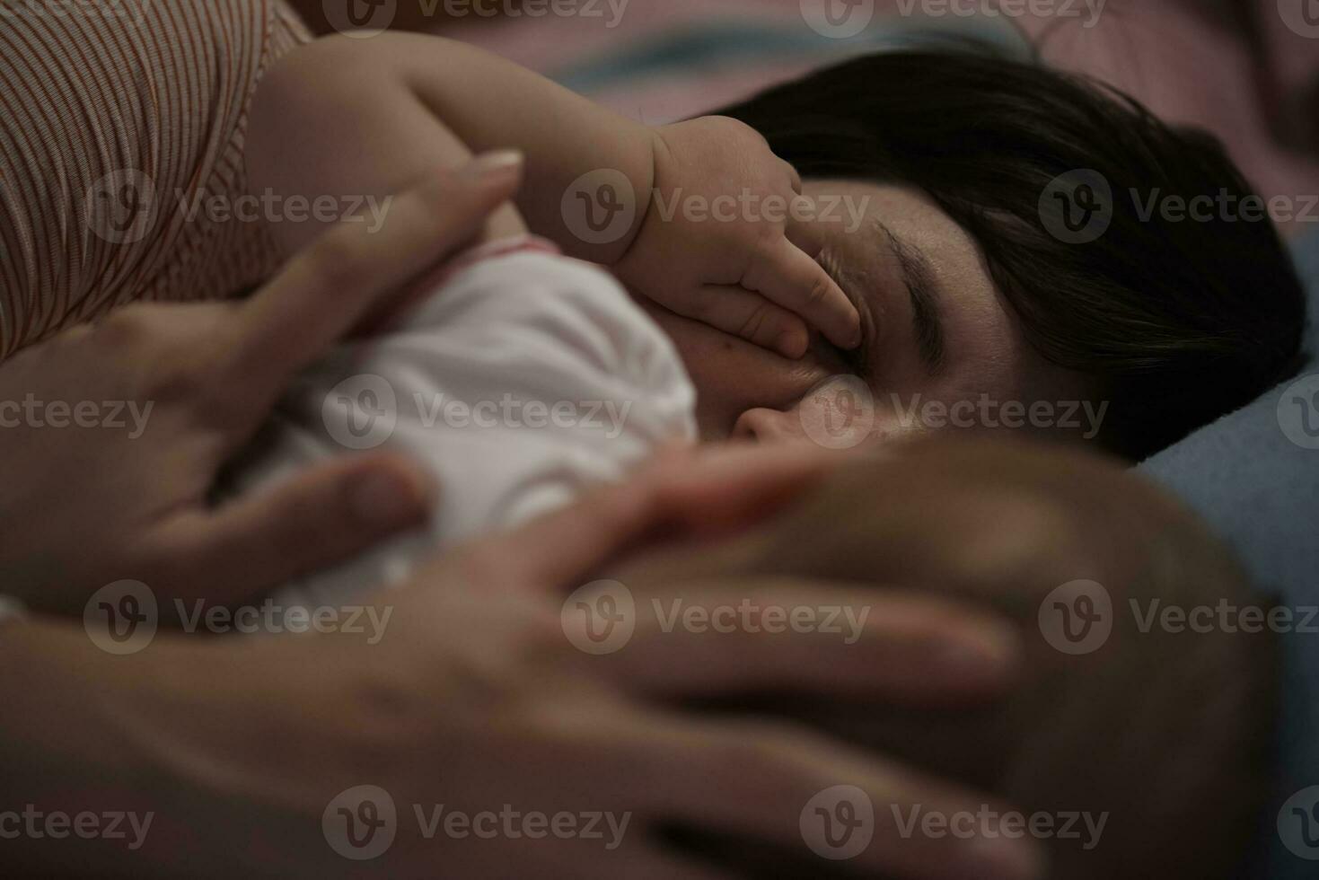 mother is playing with baby at home photo