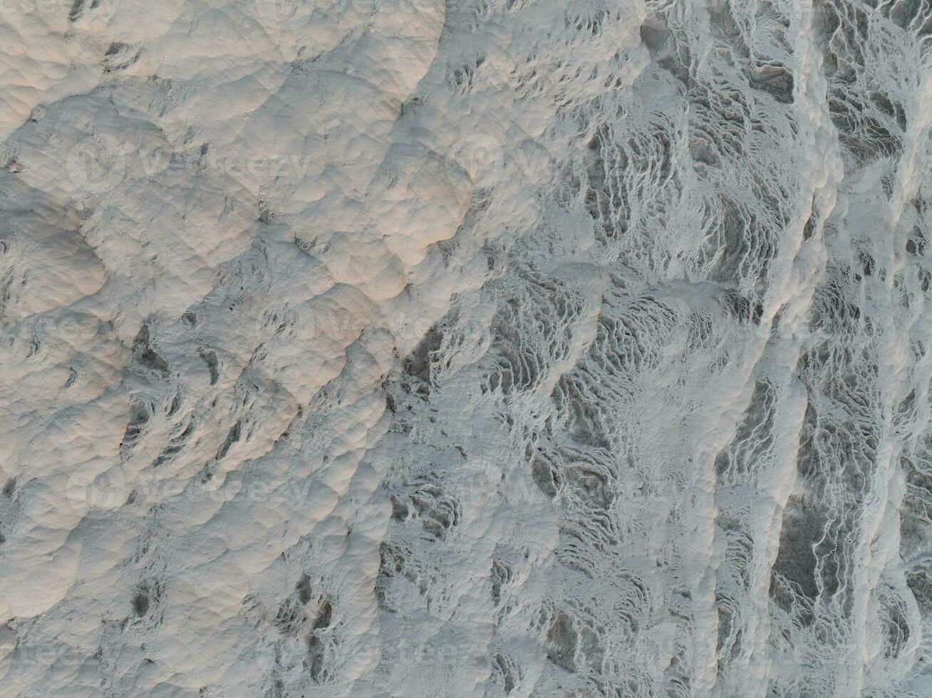 Pamukkale Travertines Cinematic Aerial Drone footage. Turkish famous white thermal bath with healthy clean water in a beautiful sunset. photo