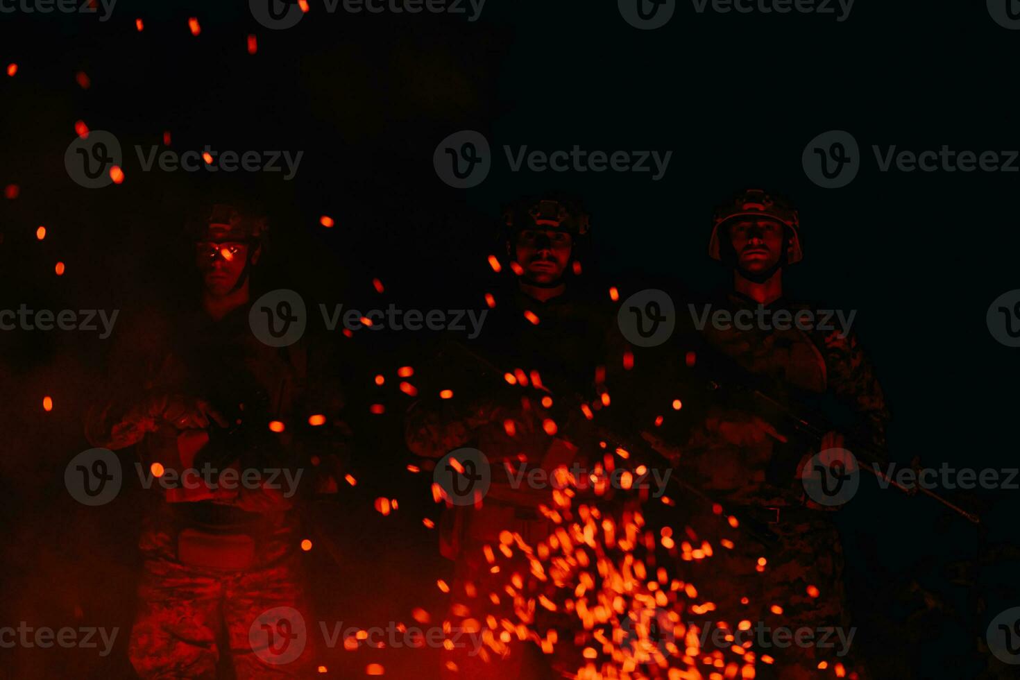 Soldiers squad in action on night mission using laser sight beam lights military team concept photo