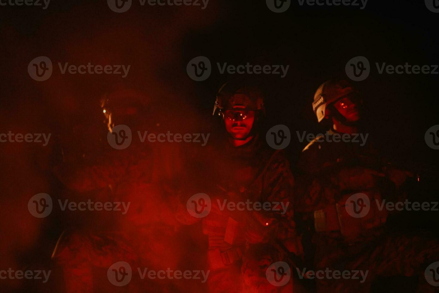 Soldiers squad in action on night mission using laser sight beam lights military team concept photo