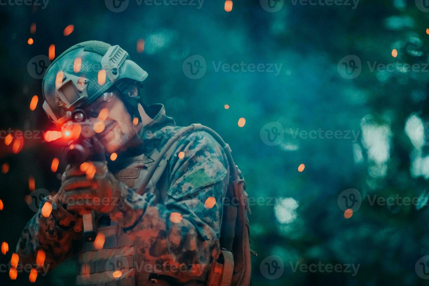 A soldier fights in a warforest area surrounded by fire photo