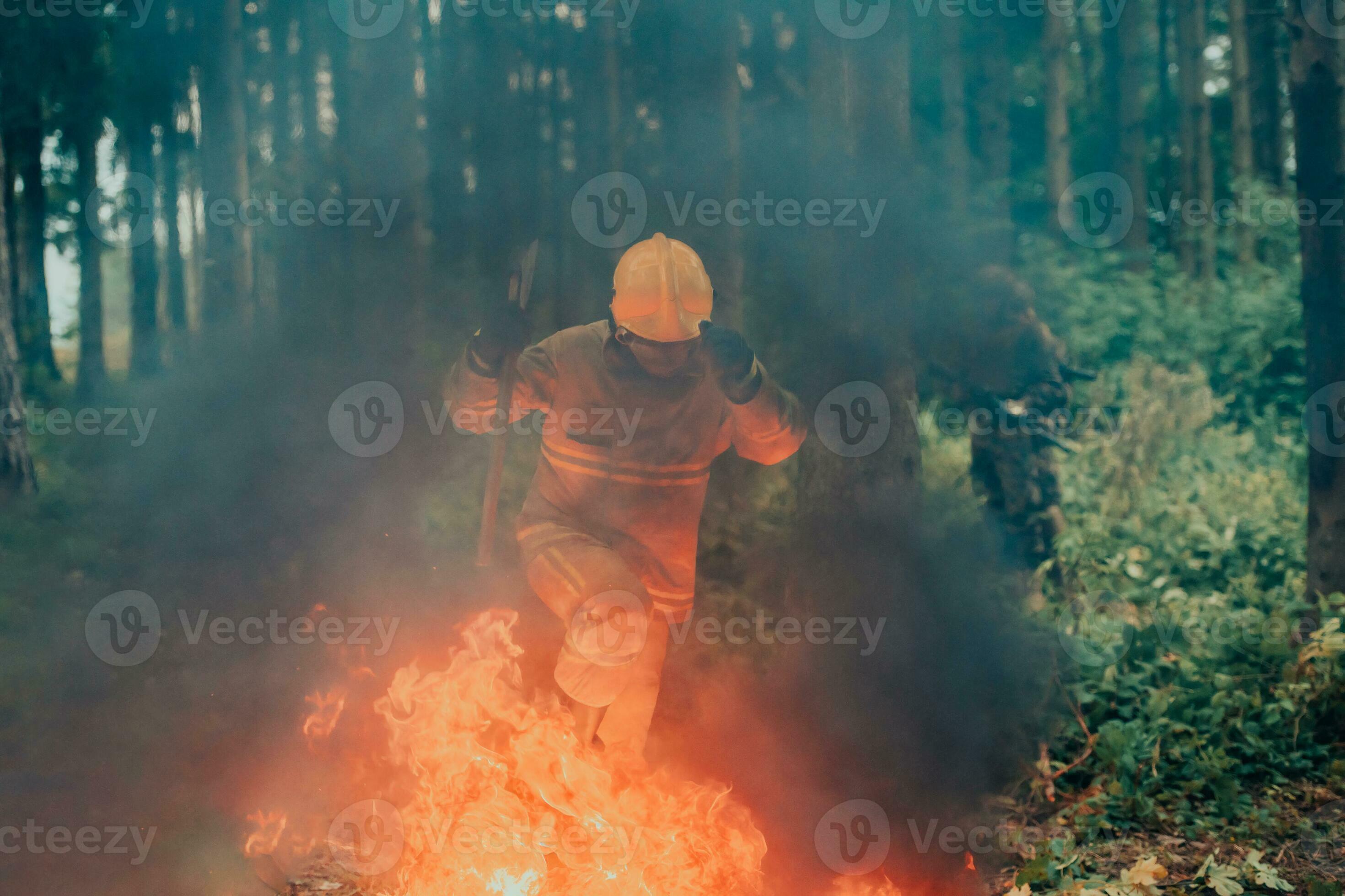 firefighter hero in action danger jumping over fire flame to rescue and