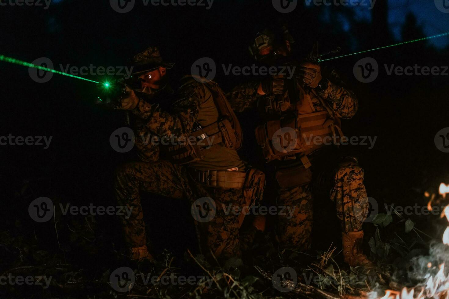Soldiers squad in action on night mission using laser sight beam lights military team concept photo