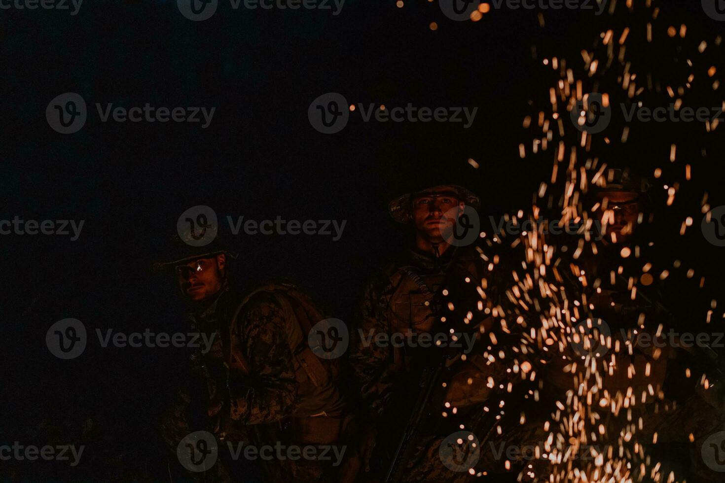 Soldiers squad in action on night mission using laser sight beam lights military team concept photo