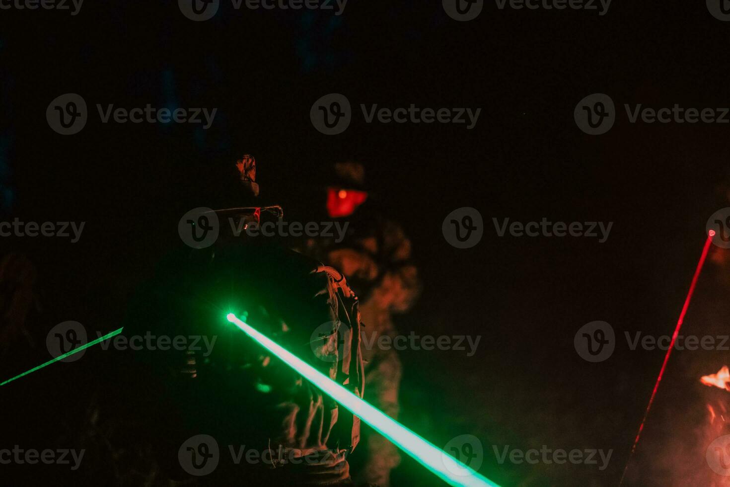 Soldiers squad in action on night mission using laser sight beam lights military team concept photo