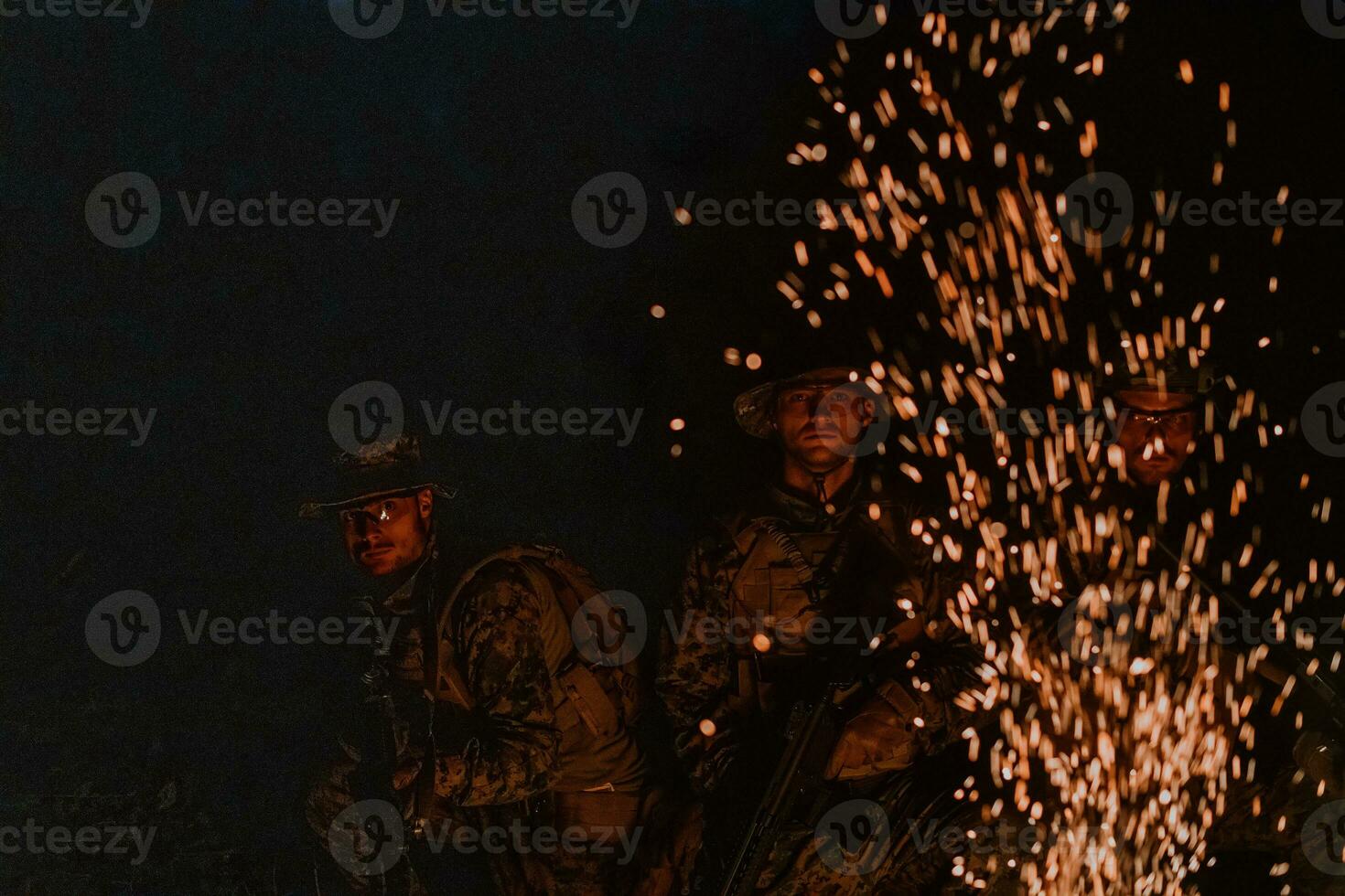 Soldiers squad in action on night mission using laser sight beam lights military team concept photo