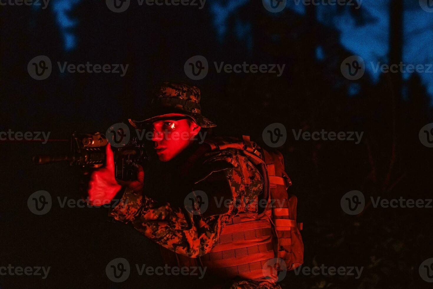 Soldiers squad in action on night mission using laser sight beam lights military team concept photo