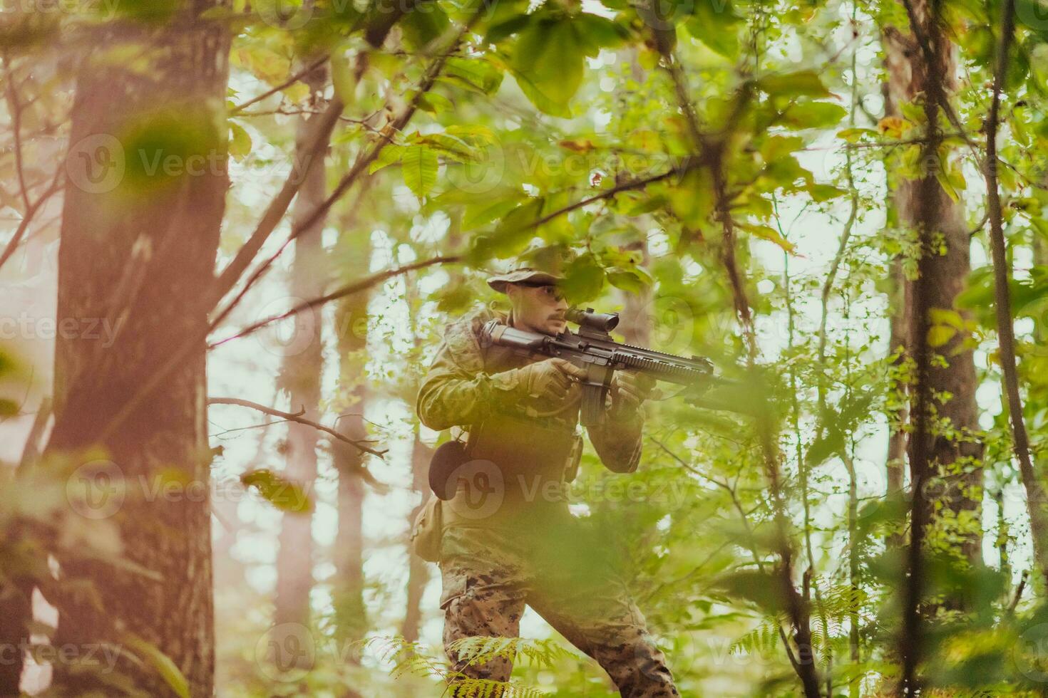 A modern warfare soldier on war duty in dense and dangerous forest areas. Dangerous military rescue operations photo