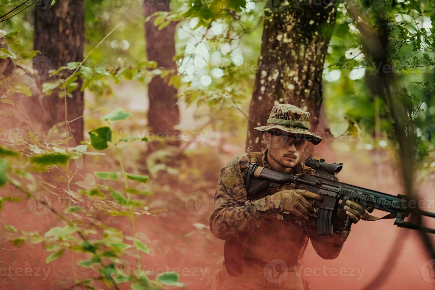 A modern warfare soldier on war duty in dense and dangerous forest areas. Dangerous military rescue operations photo