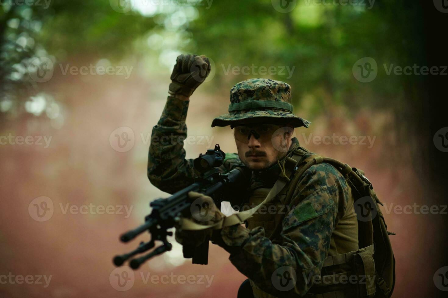 officer is  showing tactical hand signals photo