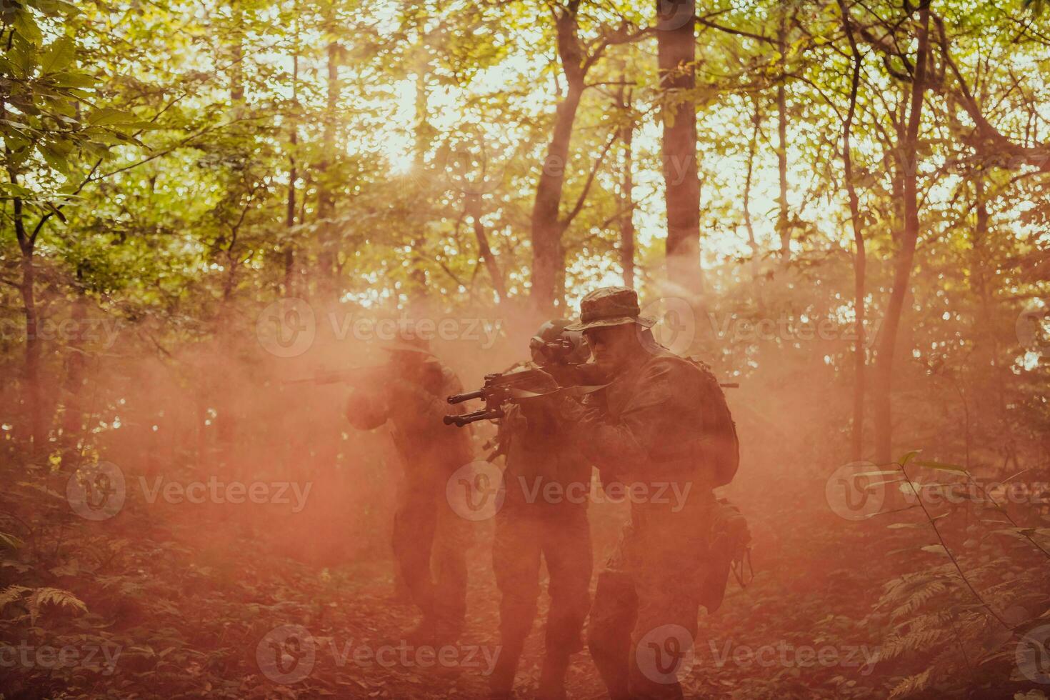 A group of modern warfare soldiers is fighting a war in dangerous remote forest areas. A group of soldiers is fighting on the enemy line with modern weapons. The concept of warfare and military conflicts photo