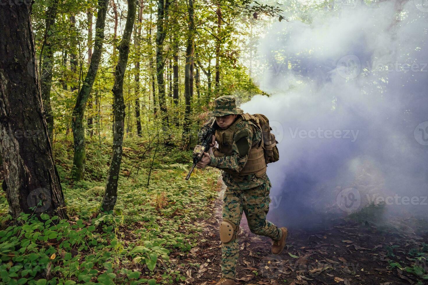 Battle of the military in the war. Military troops in the smoke photo