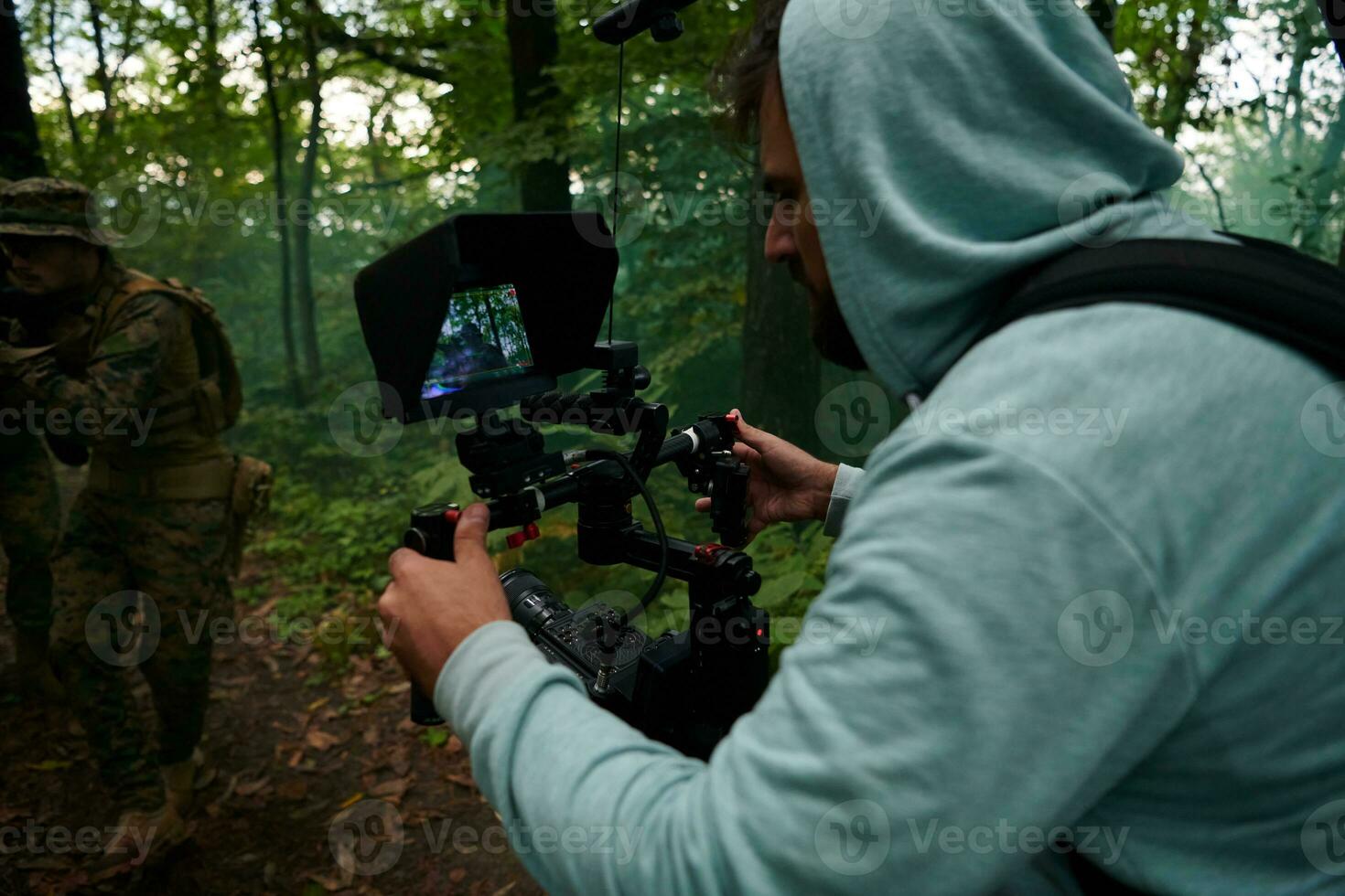 Videographer Taking Action Shoot of Soldiers in Action photo