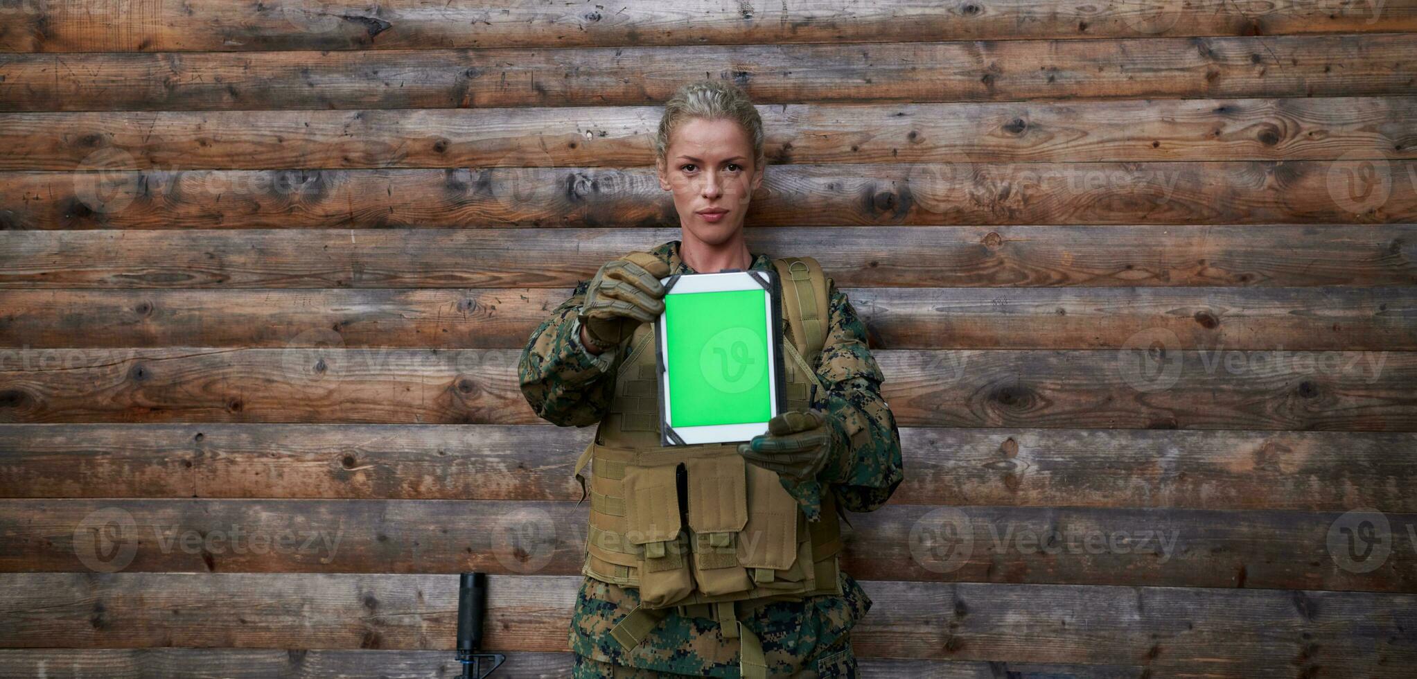 woman soldier using tablet computer photo