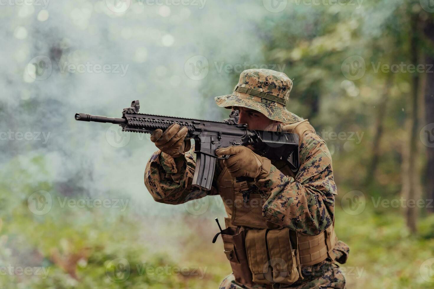 A modern warfare soldier on war duty in dense and dangerous forest areas. Dangerous military rescue operations photo