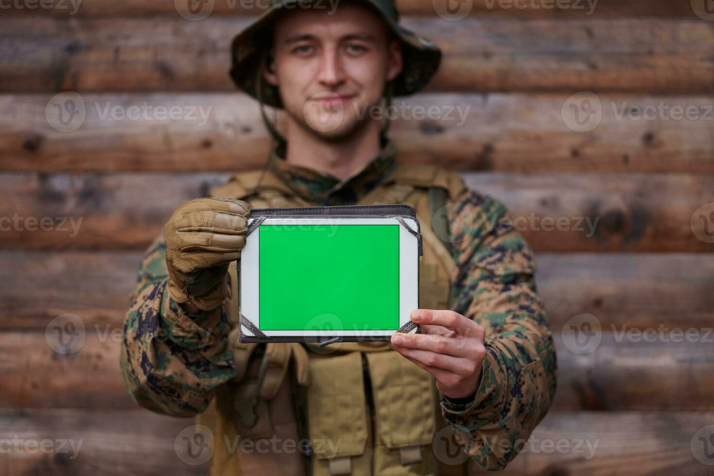 soldier using tablet computer in military camp photo