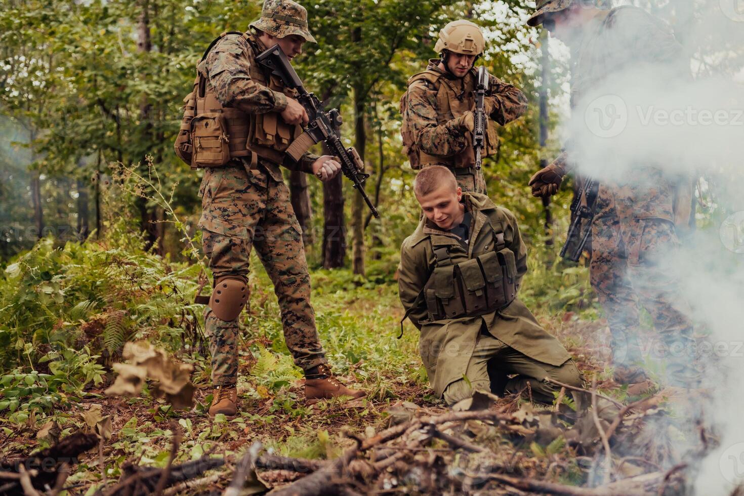 Soldiers squad was capture alive terrorist and interrogation them on them on special tactics violent way photo