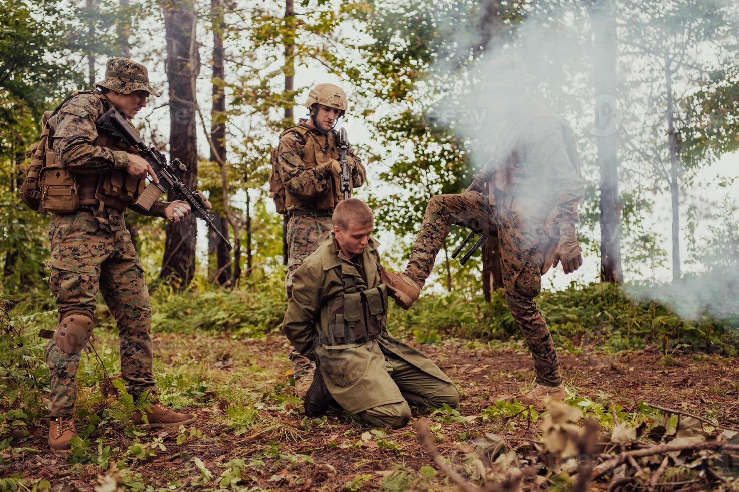 Soldiers squad was capture alive terrorist and interrogation them on them on special tactics violent way photo