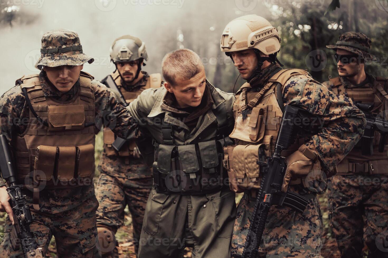Soldiers squad was capture alive terrorist and interrogation them on them on special tactics violent way photo