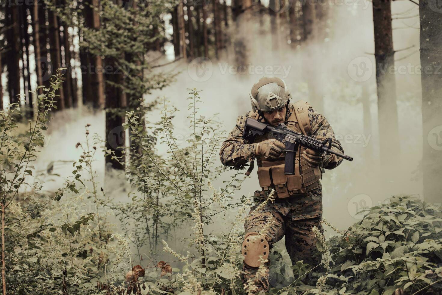 A modern warfare soldier on war duty in dense and dangerous forest areas. Dangerous military rescue operations photo