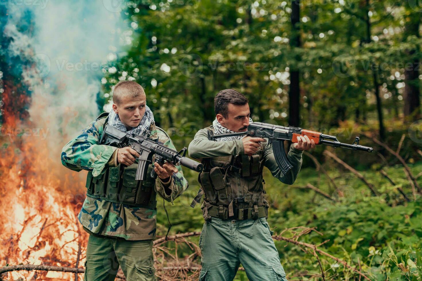 Angry terrorist militant guerrilla soldier warrior in forest photo