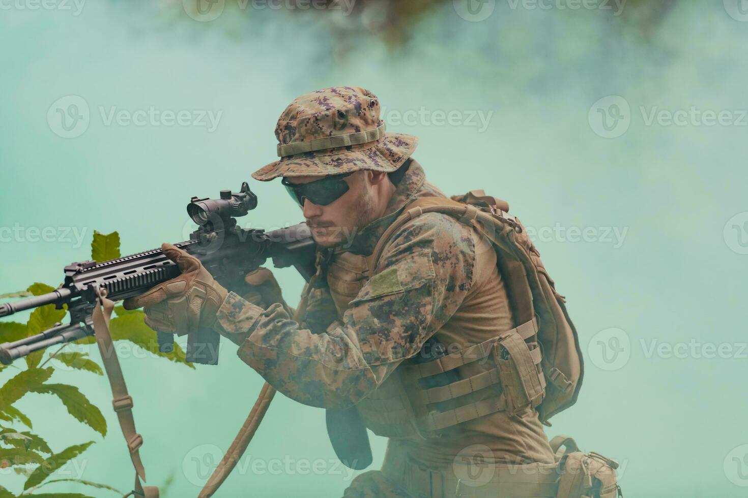 A modern warfare soldier on war duty in dense and dangerous forest areas. Dangerous military rescue operations photo