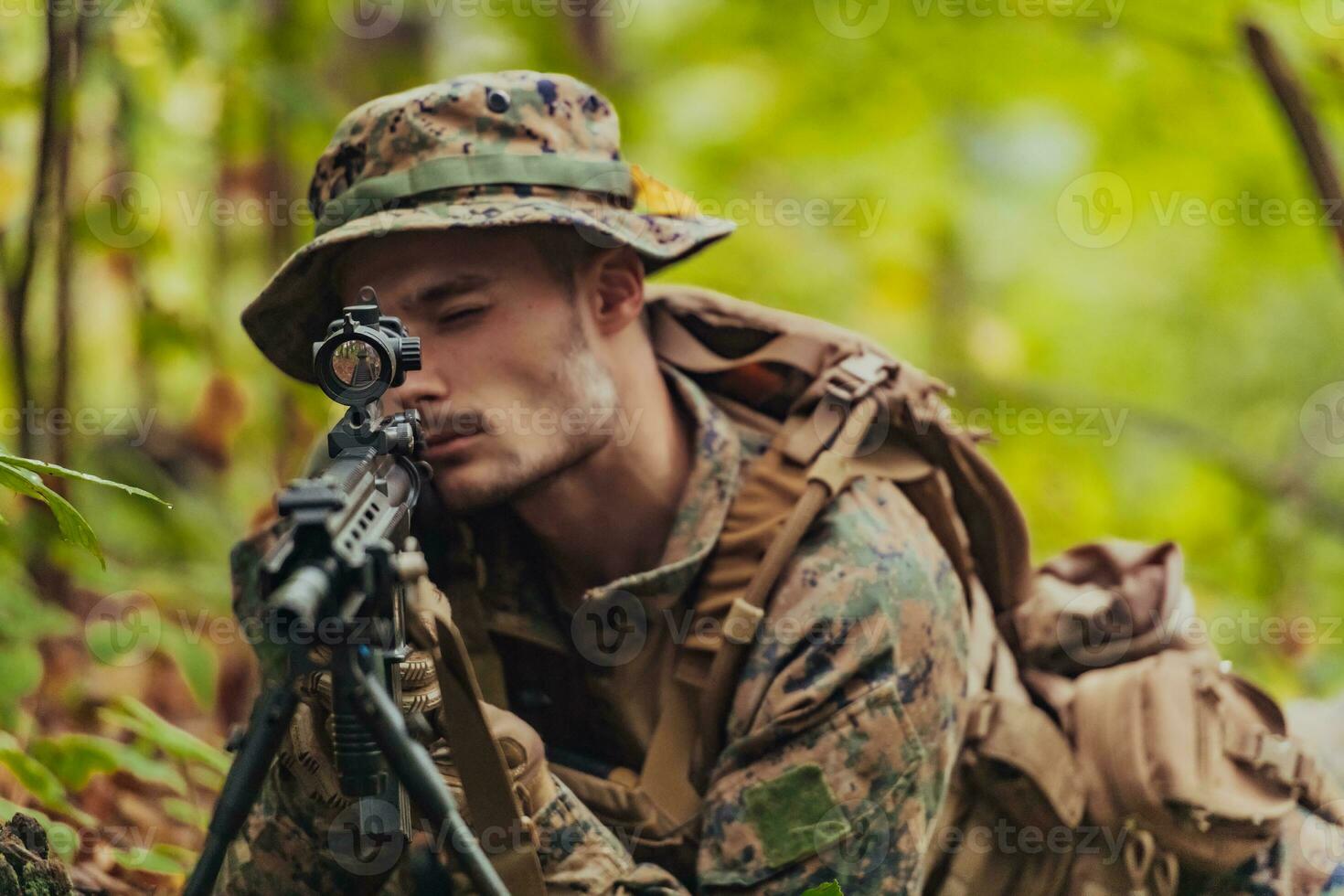A modern warfare soldier on war duty in dense and dangerous forest areas. Dangerous military rescue operations photo