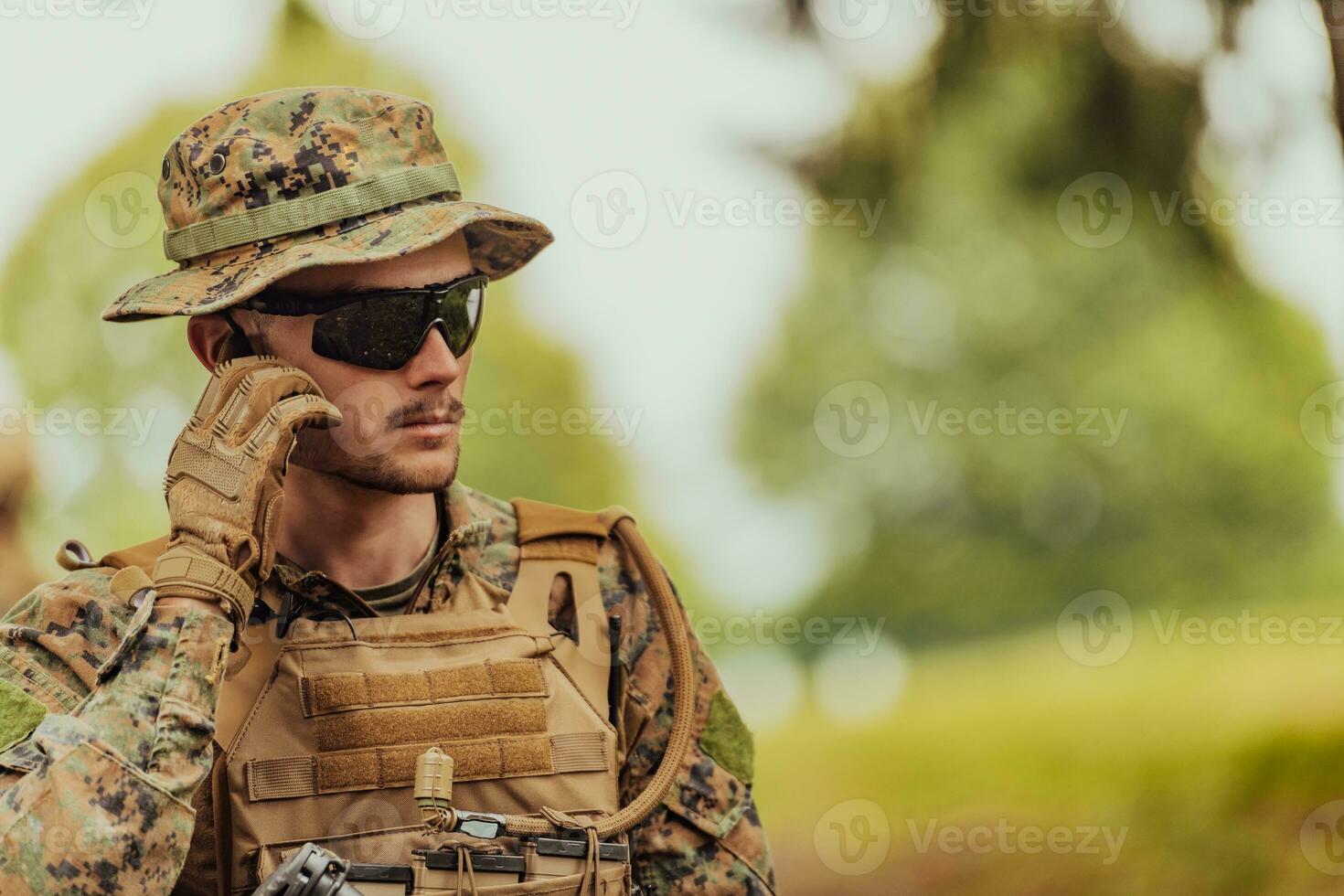 American marine corps special operations soldier preparing tactical and commpunication gear for action battle closeup photo