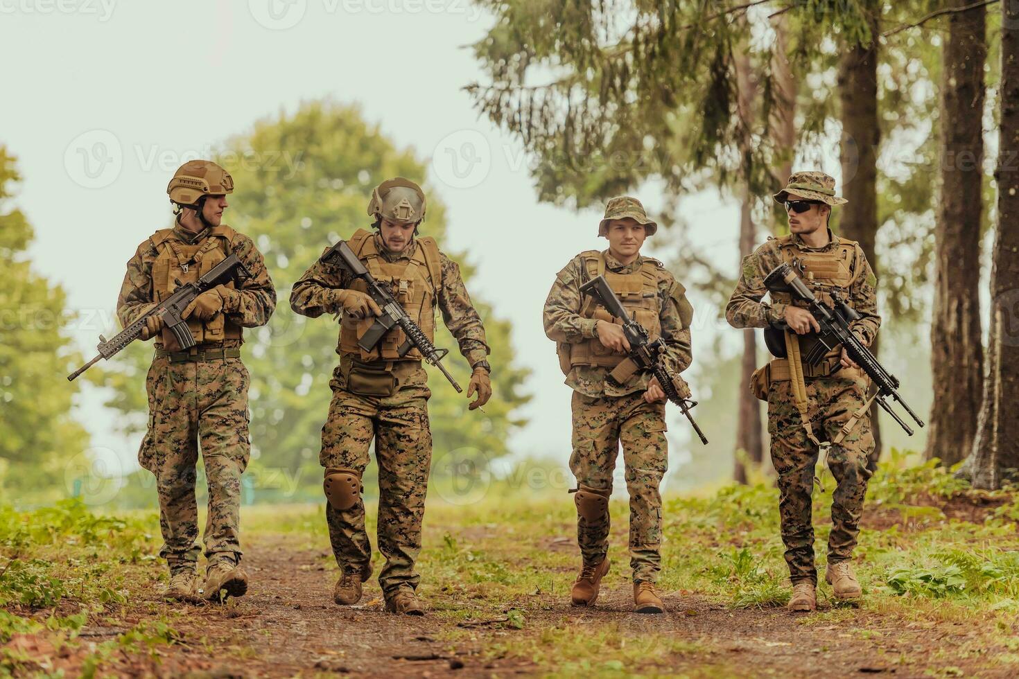 Soldier fighters standing together with guns. Group portrait of US army elite members, private military company servicemen, anti terrorist squad photo