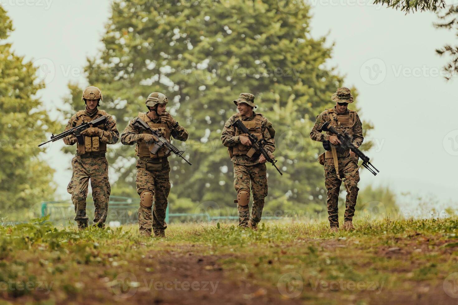 Soldier fighters standing together with guns. Group portrait of US army elite members, private military company servicemen, anti terrorist squad photo