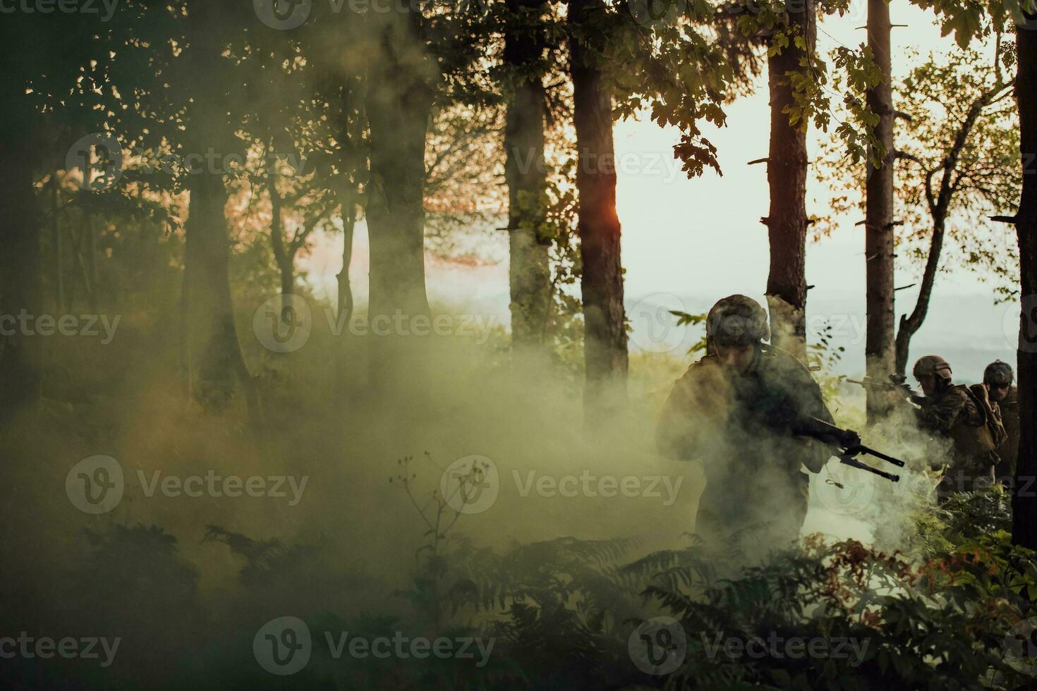 A group of modern warfare soldiers is fighting a war in dangerous remote forest areas. A group of soldiers is fighting on the enemy line with modern weapons. The concept of warfare and military conflicts photo