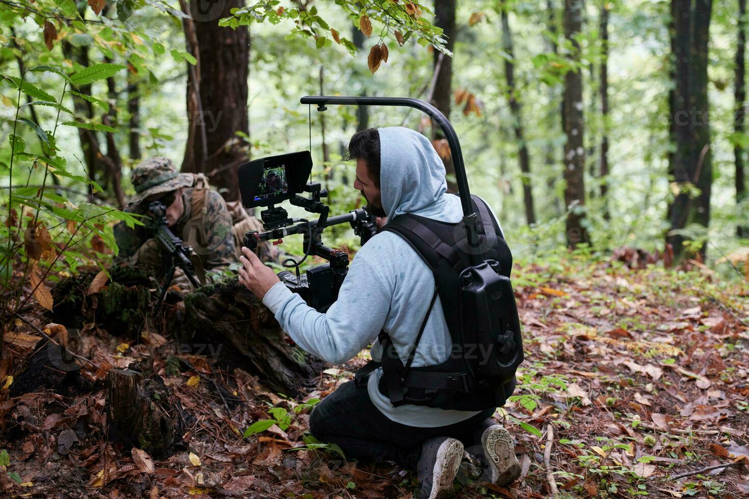 Videographer Taking Action Shoot of Soldiers in Action photo