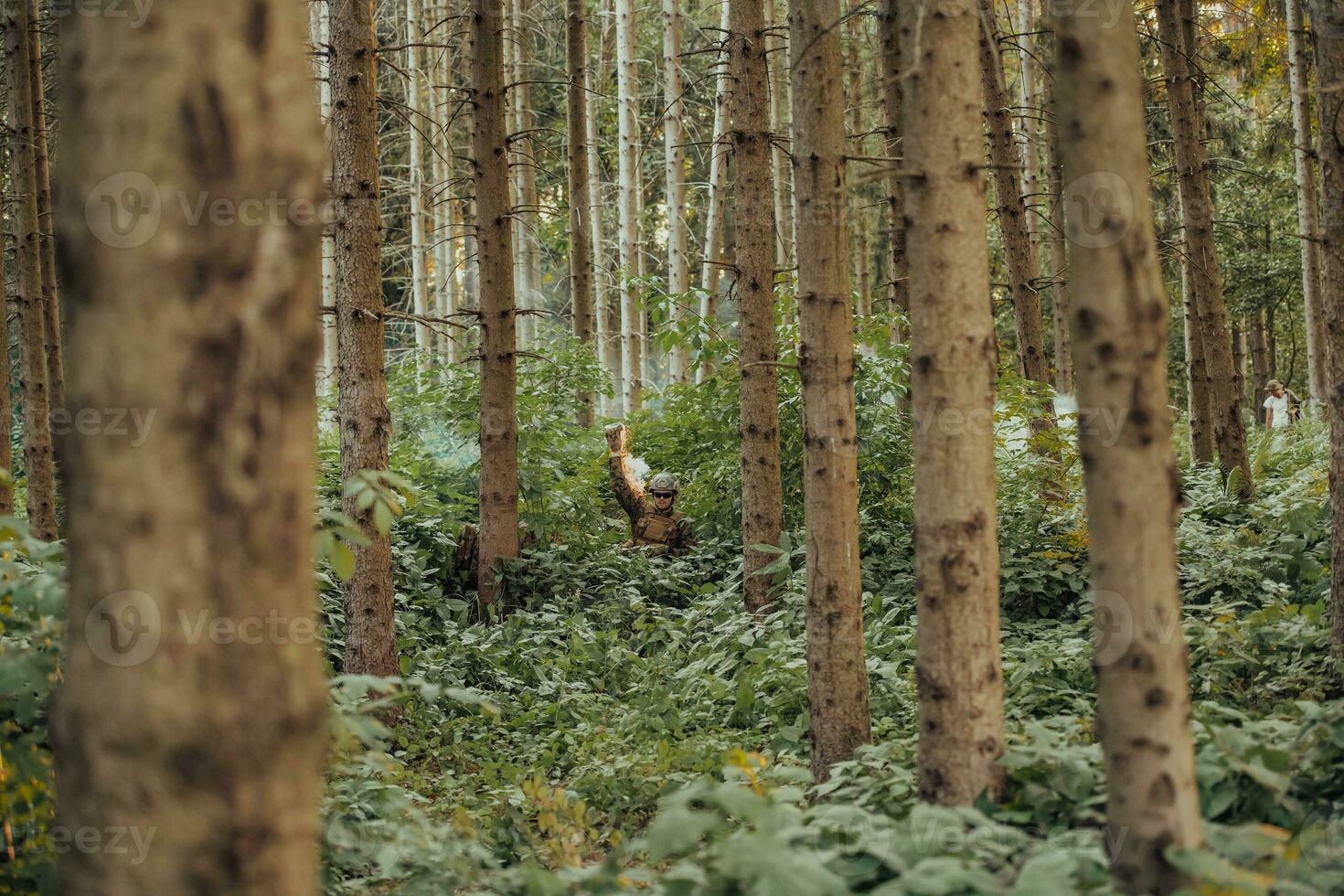 A group of modern warfare soldiers is fighting a war in dangerous remote forest areas. A group of soldiers is fighting on the enemy line with modern weapons. The concept of warfare and military conflicts photo