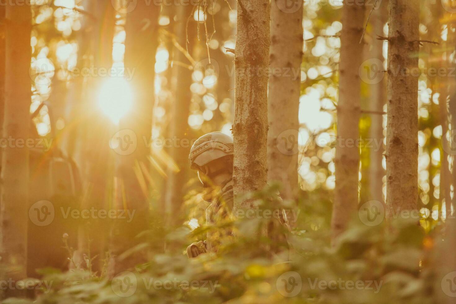 A group of modern warfare soldiers is fighting a war in dangerous remote forest areas. A group of soldiers is fighting on the enemy line with modern weapons. The concept of warfare and military conflicts photo