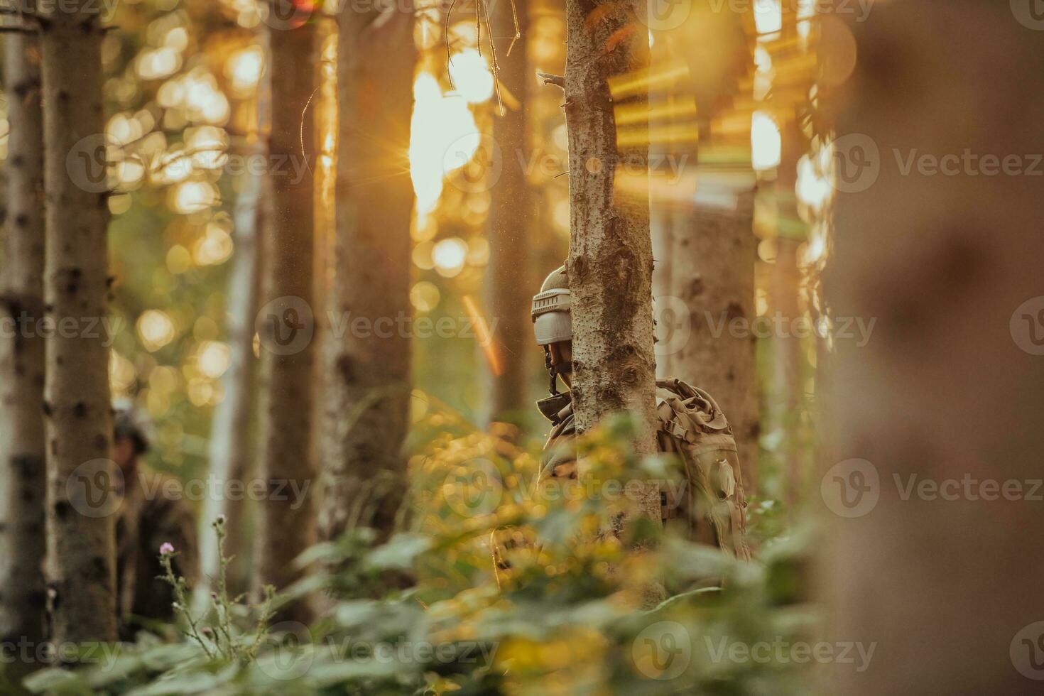 A group of modern warfare soldiers is fighting a war in dangerous remote forest areas. A group of soldiers is fighting on the enemy line with modern weapons. The concept of warfare and military conflicts photo