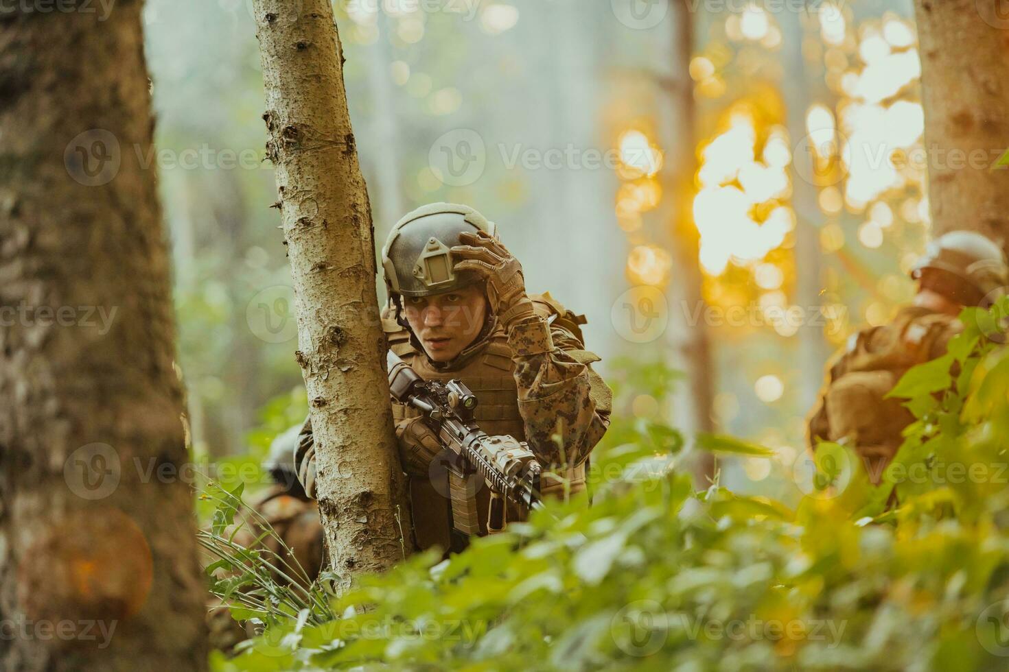 A modern warfare soldier on war duty in dense and dangerous forest areas. Dangerous military rescue operations photo