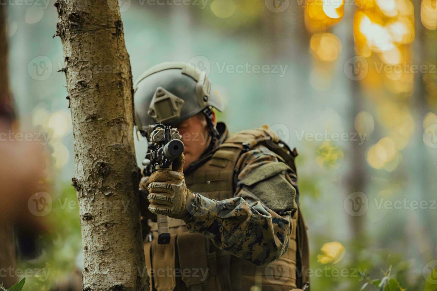 A modern warfare soldier on war duty in dense and dangerous forest areas. Dangerous military rescue operations photo