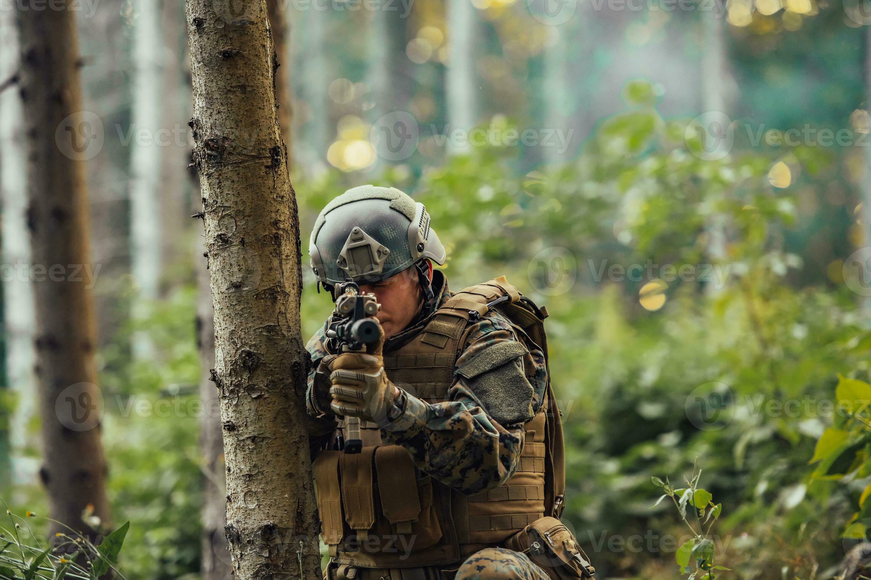 A modern warfare soldier on war duty in dense and dangerous forest ...