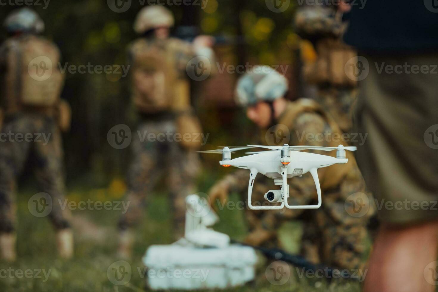 Modern Warfare Soldiers Squad are Using Drone for Scouting and Surveillance During Military Operation in the Forest. photo