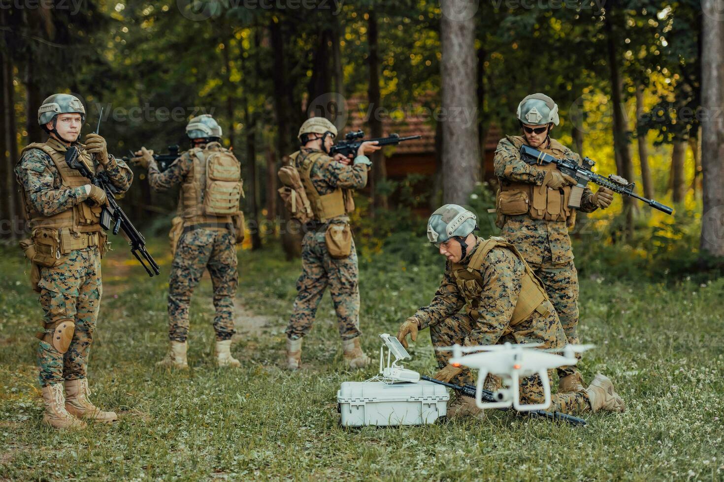 Modern Warfare Soldiers Squad are Using Drone for Scouting and Surveillance During Military Operation in the Forest. photo