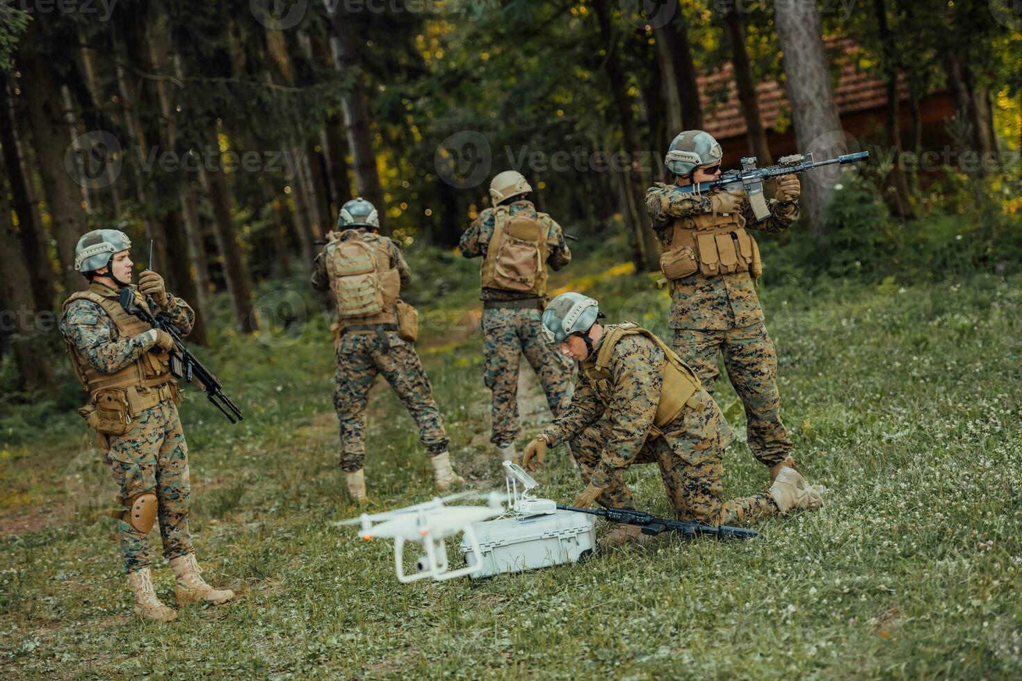 Modern Warfare Soldiers Squad are Using Drone for Scouting and Surveillance During Military Operation in the Forest. photo