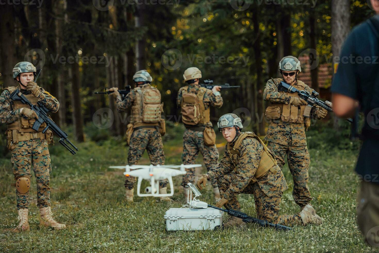 Modern Warfare Soldiers Squad are Using Drone for Scouting and Surveillance During Military Operation in the Forest. photo