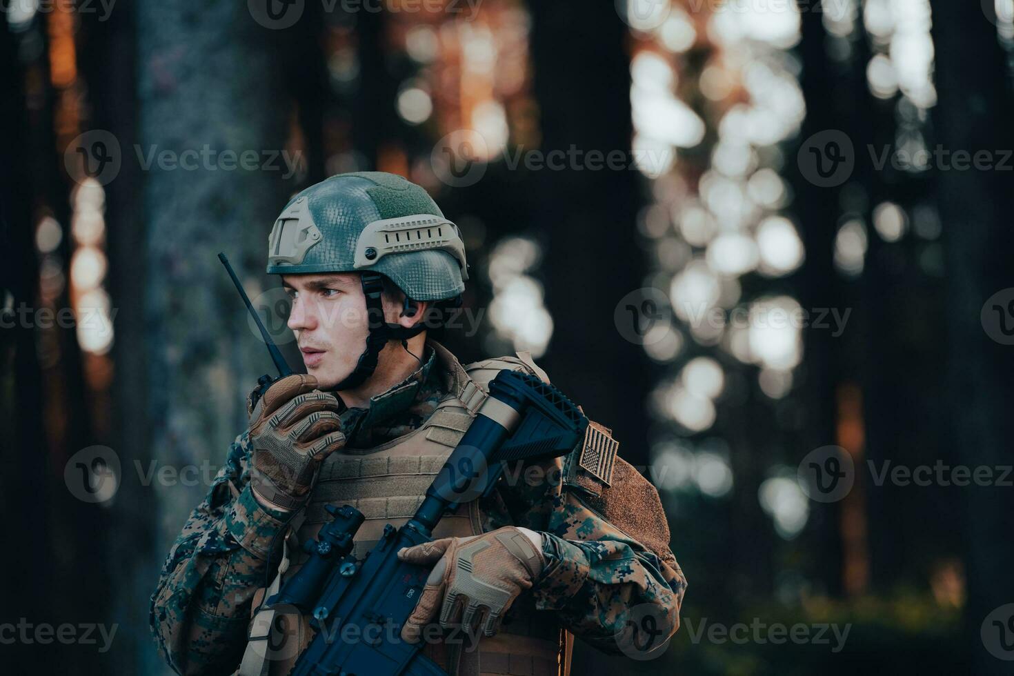 Modern Warfare Soldier Commander Officer Talking Portable Radio Station and Give Orders Subdivision Squad photo