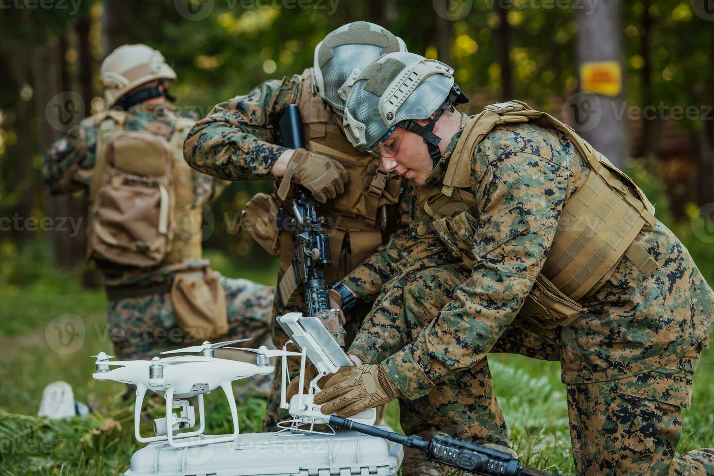 Modern Warfare Soldiers Squad are Using Drone for Scouting and Surveillance During Military Operation in the Forest. photo