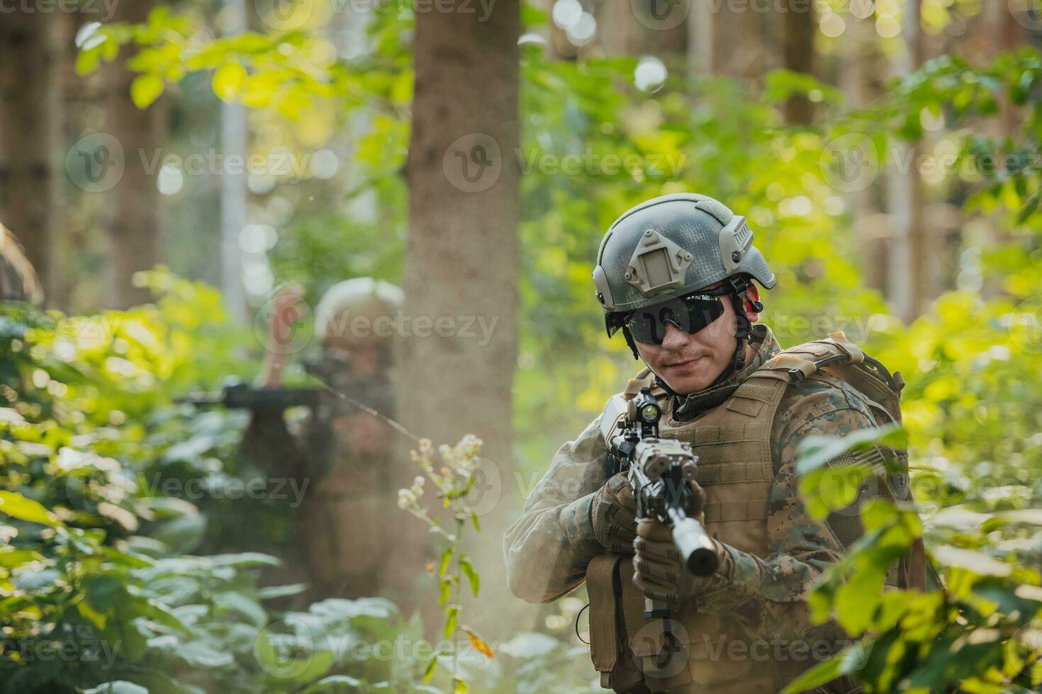 A group of modern warfare soldiers is fighting a war in dangerous remote forest areas. A group of soldiers is fighting on the enemy line with modern weapons. The concept of warfare and military conflicts photo