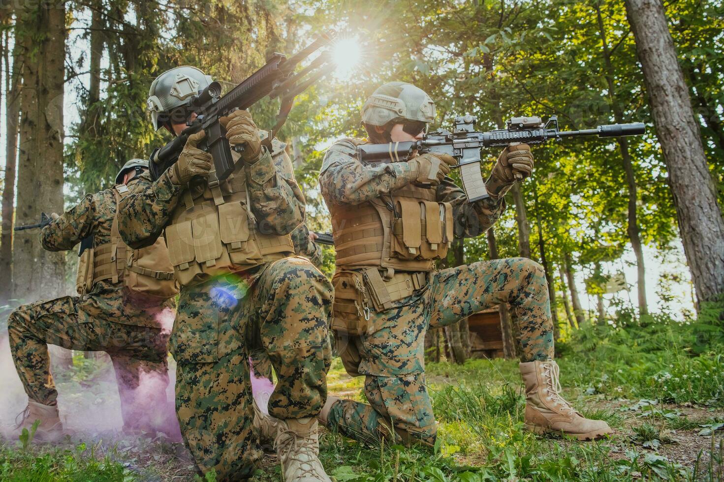 Soldier fighters standing together with guns. Group portrait of US army elite members, private military company servicemen, anti terrorist squad photo