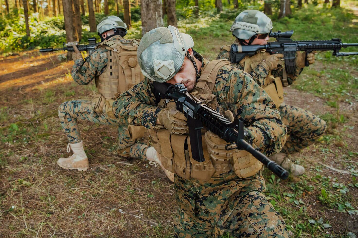 Soldier fighters standing together with guns. Group portrait of US army elite members, private military company servicemen, anti terrorist squad photo